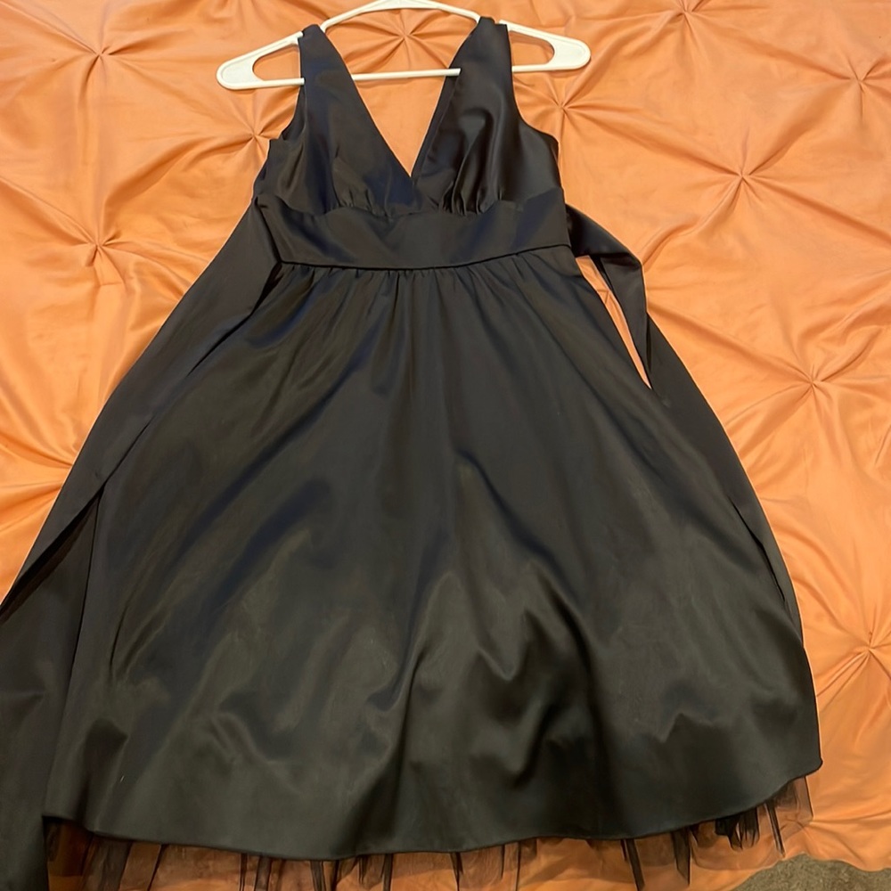 Little black dress. Has tool underneath.